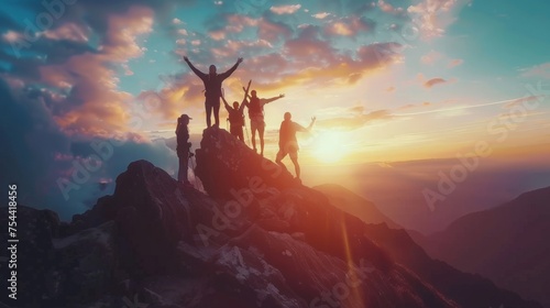 Male hiker celebrating success on top of a mountain in a majestic sunrise and Climbing group friends helping hike up .Teamwork , Helps ,Success, winner and Leadership © Sasint