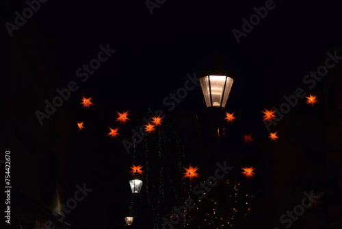 Star shaped Christmas lights around a lamp post