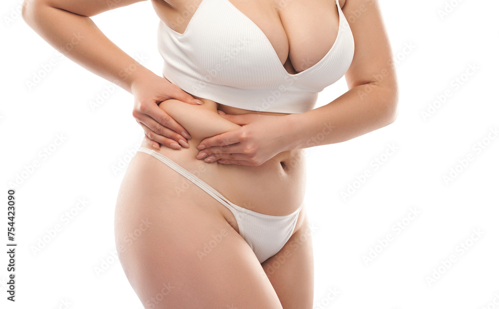 The girl stretches the skin on the leg and on the stomach, showing fat deposits. Treatment and getting rid of excess weight, the deposition of subcutaneous fat. The girl stretches the skin on the leg and on the stomach, showing fat deposits. Treatment and getting rid of excess weight, the deposition of subcutaneous fat.