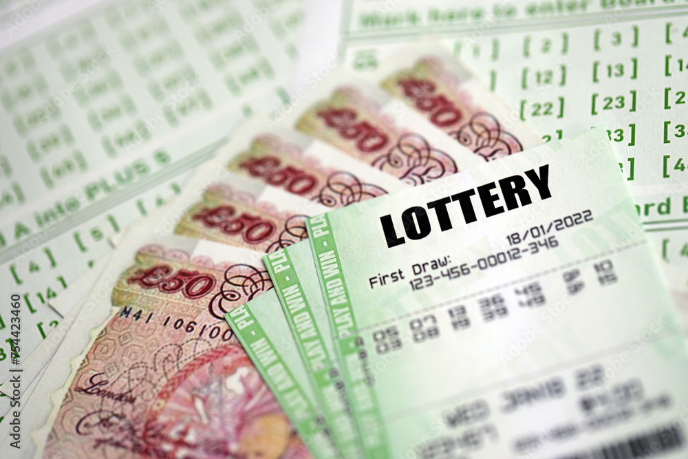 Green lottery tickets and Great Britain pounds money bills on blank with numbers for playing lottery close up Green lottery tickets and Great Britain pounds money bills on blank with numbers for playing lottery close up