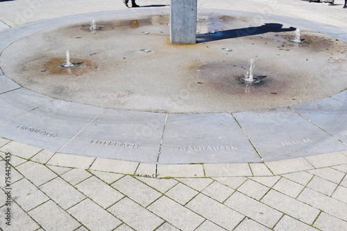 fountain with the next village names to each direction photo