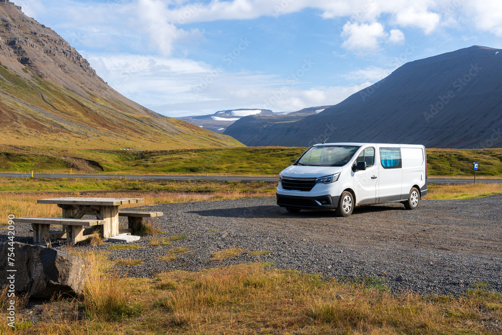 Campervan parked at resting area in Westfjords, Iceland. Adventure and road trip concept