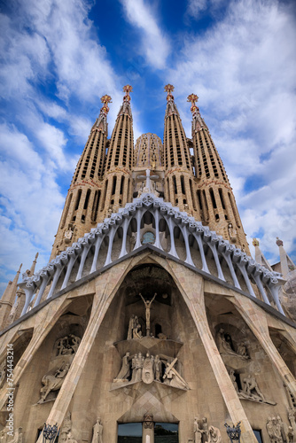 Passion Façade of the Sagrada Família with a cloudy sky in Barcelona, Spain. photo