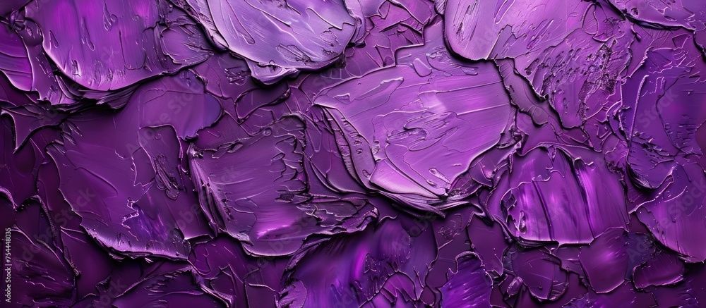 Obraz premium A close-up view of a wall covered in rich purple paint, highlighting the vibrant color against the textured surface.