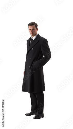 Handsome mysterious gangster man with his hands in his pockets. Shirt and toe with a long black trench coat. Isolated transparent PNG background. 
