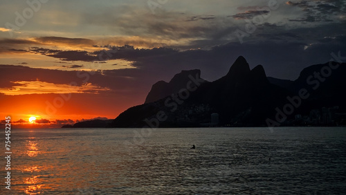 Summer sunset over Dois Irmaos at Ipanema beach in Rio de Janeiro.