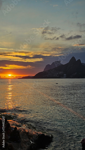  Vertical shot of a sunset over Ipanema and Leblon beach taken from Arpoador in Rio de Janeiro.