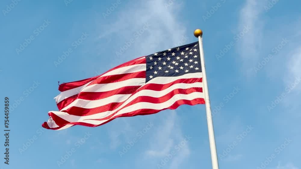 USA American flag on a flagpole waving in the wind. Labor Day, Independence Day, Flag Day, Memorial, Veterans, President's Day Patriots USA American flag on a flagpole waving in the wind. Labor Day, Independence Day, Flag Day, Memorial, Veterans, President's Day Patriots