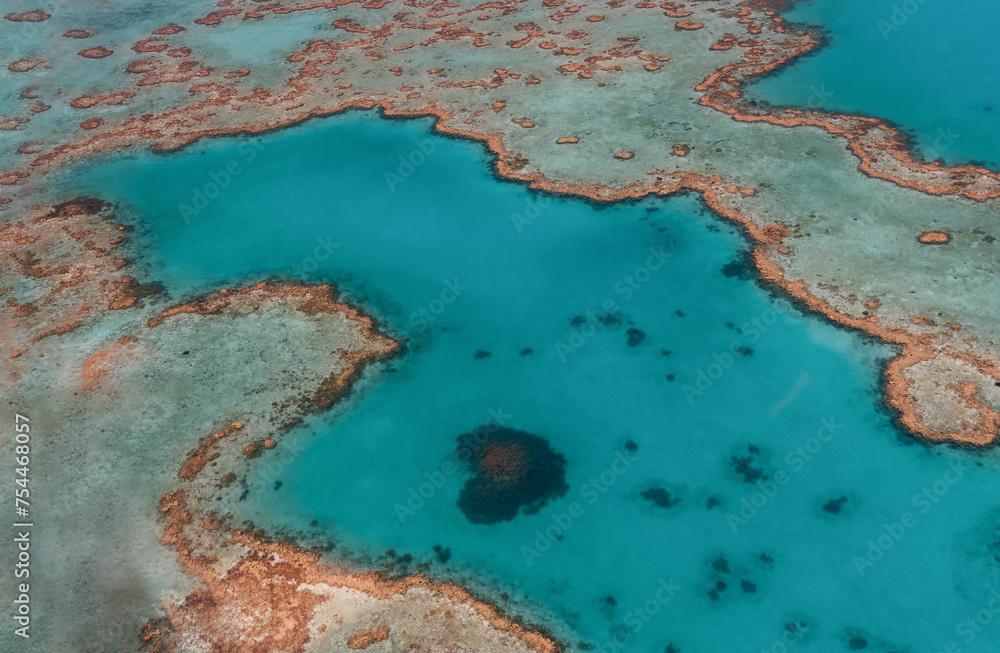 Aerial view of Great Barrier Reef coral reef structure in Whitsundays, Aerilie beach, Queensland, Australia