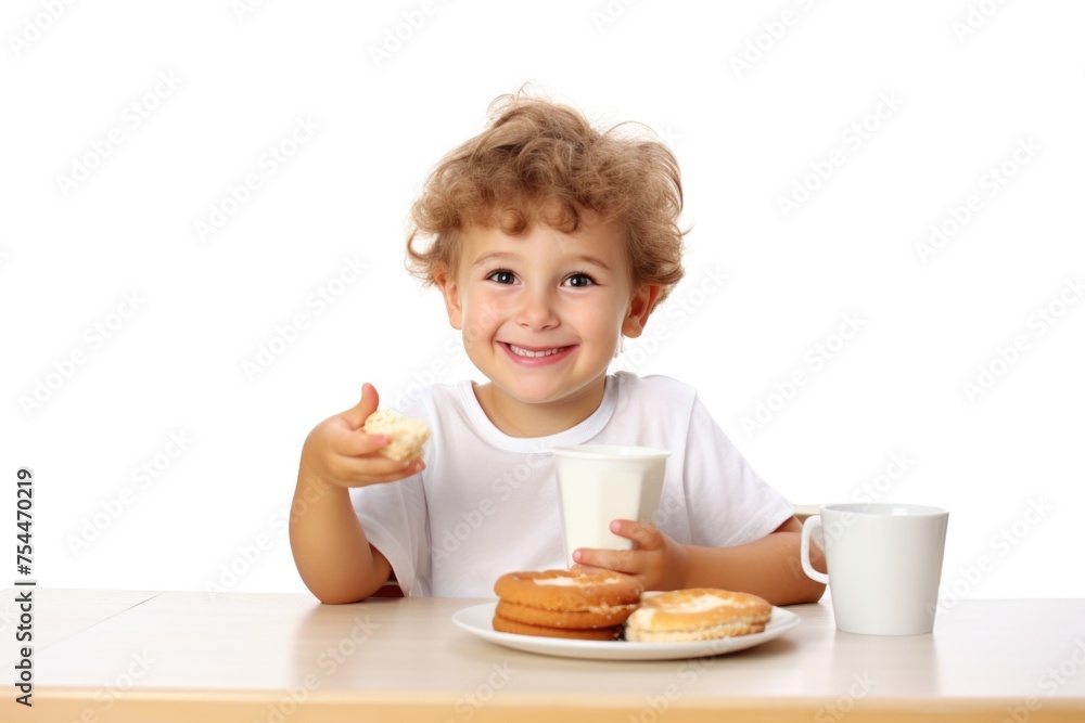 A little boy sitting at a table with donuts and a glass of milk. Perfect for food and family-themed designs A little boy sitting at a table with donuts and a glass of milk. Perfect for food and family-themed designs