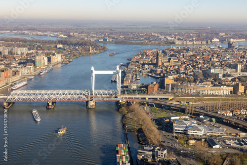 Dutch city Dordrecht with railway bridge over river Oude Maas