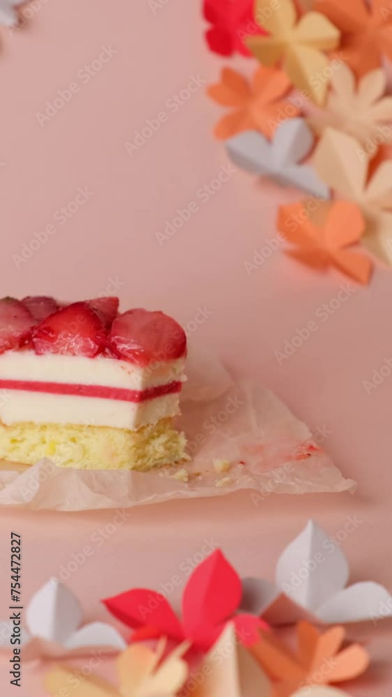 Close-up of a spoon breaking a strawberry cake Close-up of a spoon breaking a strawberry cake