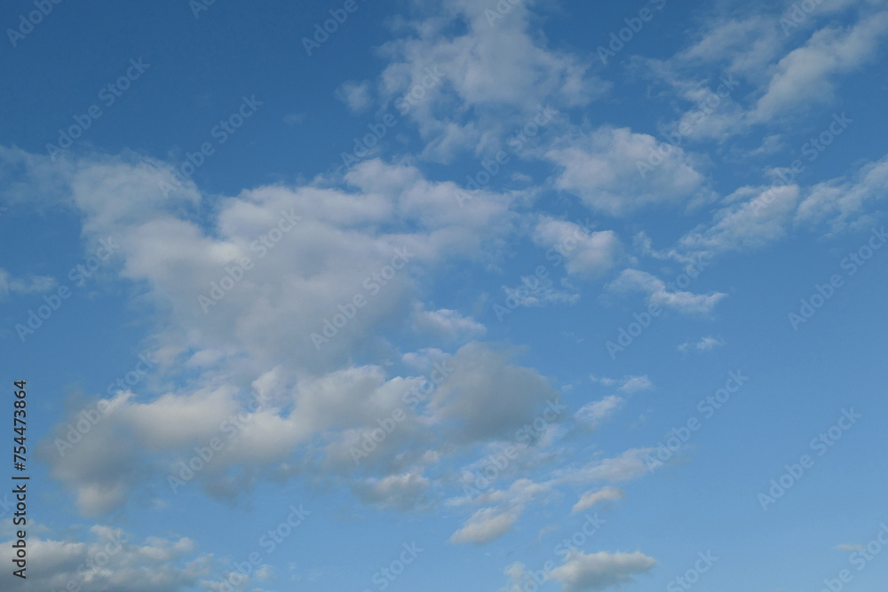 Grey and white clouds seen against a blue sky during the day. Grey and white clouds seen against a blue sky during the day.