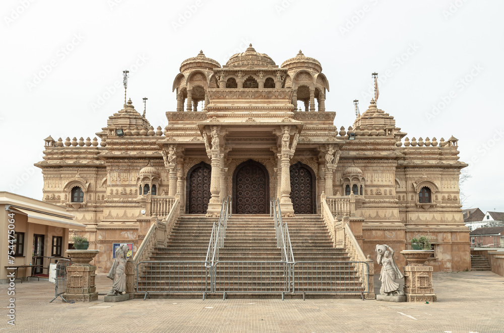 Exterior view of The Shree Sanatan Hindu Mandir Hindu Temple. Elaborately carved Jaisalmer limestone of the entrance to the Shri Sanatan Hindu Temple, Space for text, Selective focus.