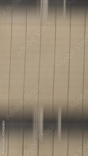 Wallpaper Mural Vertically blurred wall of building in motion. Falling from a high-rise building view from the first person. Vertically motion blurred wall for transition. Torontodigital.ca