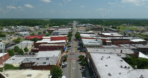 Southern architecture and Main street traffic in Tifton GA. Small town America downtown with narrow driveways and flat roof buildings photo