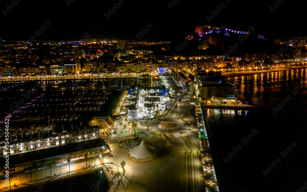 Alicante by night view from drone above marine, Spain