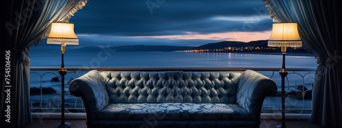 Blue velvet tufted settee on balcony overlooking ocean at sunset in photorealistic style photo