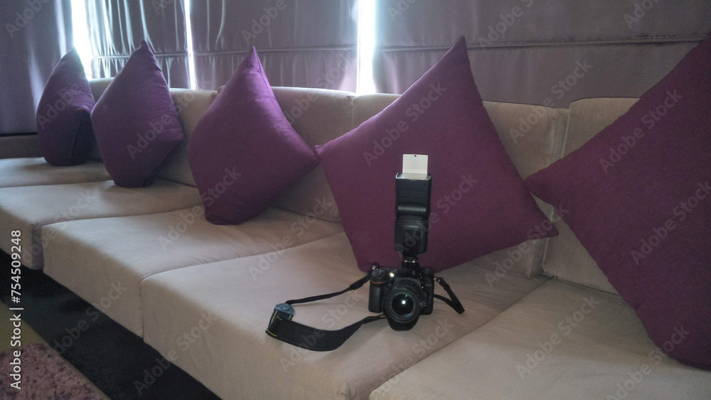 A camera on a sofa in a hotel room, Kandy, Sri Lanka. - obrazy, fototapety, plakaty 