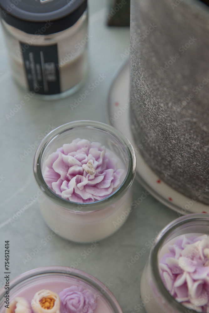 Candles in the form of colorful flowers