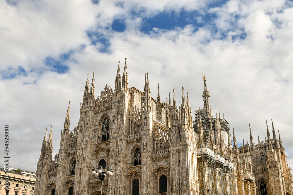 High-section of the Milan Cathedral (Duomo), which took nearly six centuries to complete: construction began in 1386, and the final details were completed in 1965, Milan, Lombardy, Italy High-section of the Milan Cathedral (Duomo), which took nearly six centuries to complete: construction began in 1386, and the final details were completed in 1965, Milan, Lombardy, Italy