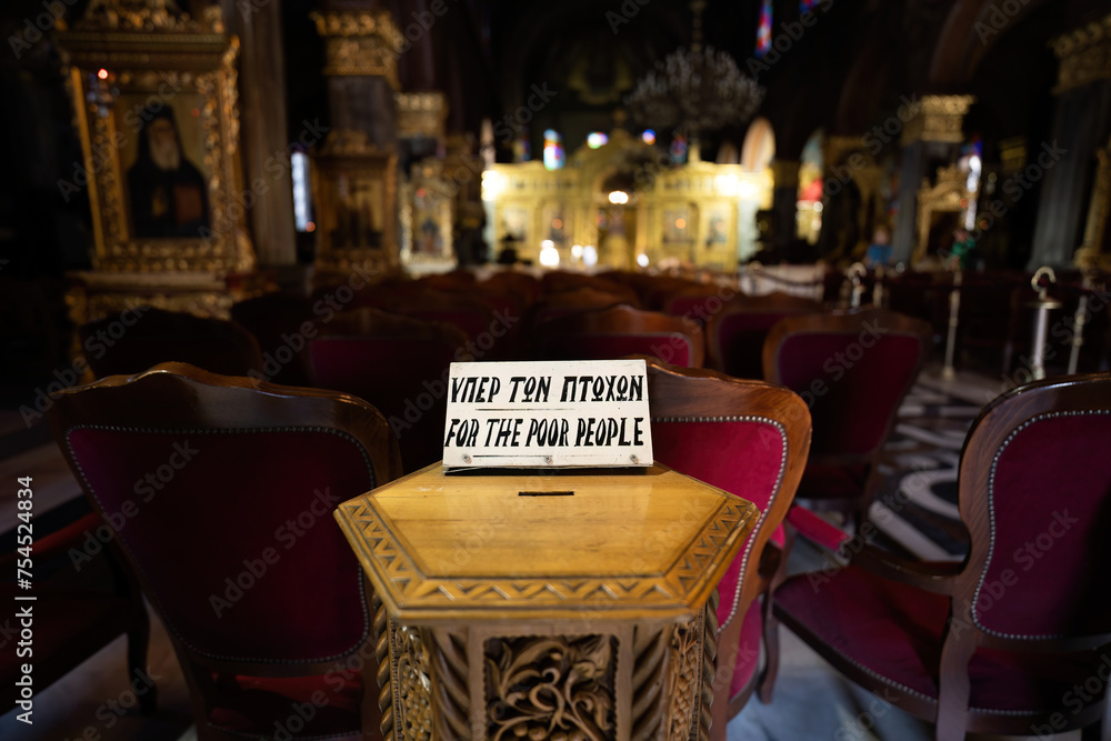 Zakynthos, Greece - September 22, 2022: Donation box saying for poor people kept inside a church or temple