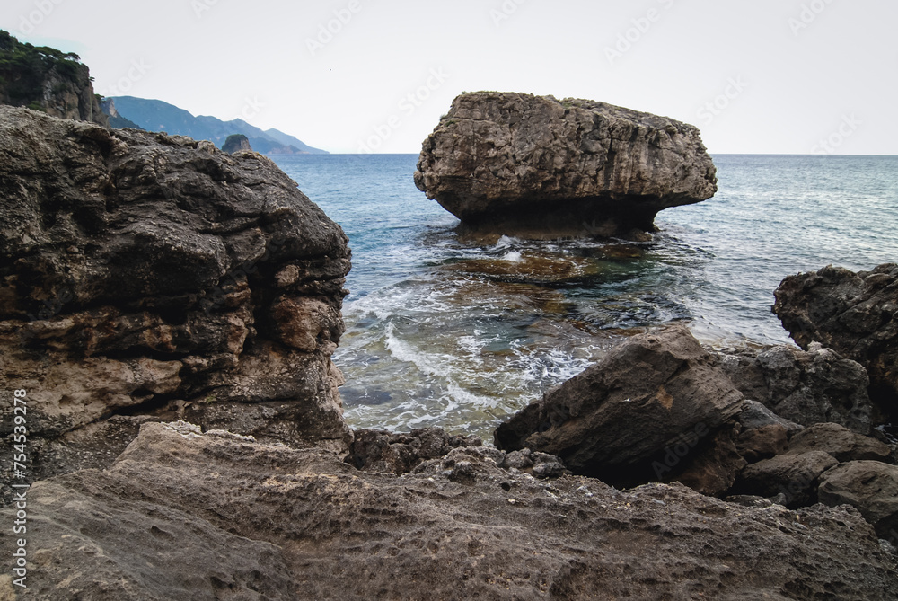 Rocky Ionian Sea shore near Sinarades village on Corfu Island, Greece