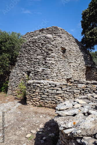 Dry stone cottage in Village des Bories open air museum near Gordes village in Provence region of France photo