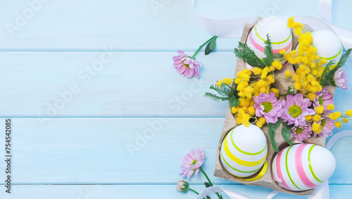 Easter composition with Easter eggs and flowers