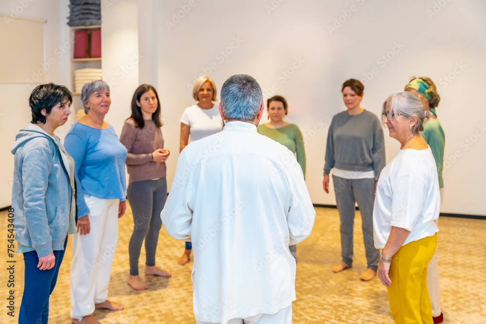 Mature students arriving in a qigong class