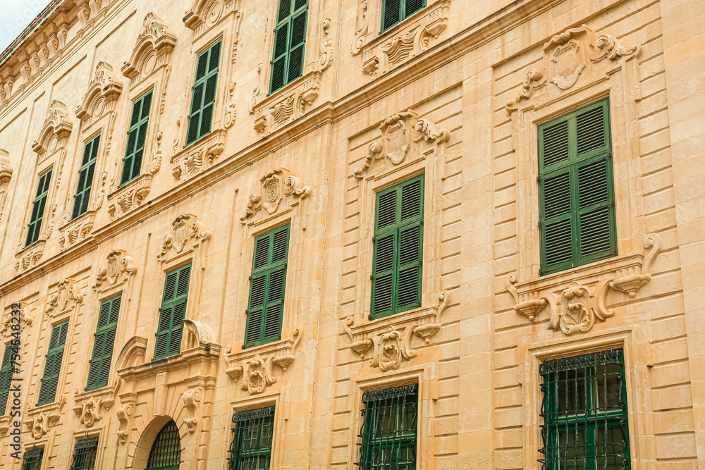 View of old building with windows in city