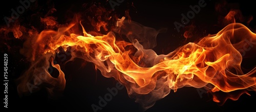 A close-up view of a fiery blaze burning fiercely, emitting sparks, against a stark black backdrop. The flames dance and flicker, creating a dynamic and striking contrast.