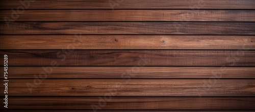 A detailed view of a dark brown wooden wall featuring a nature strip pattern, suitable for design and decoration concepts. The texture of the wood adds a natural abstract element to any space.