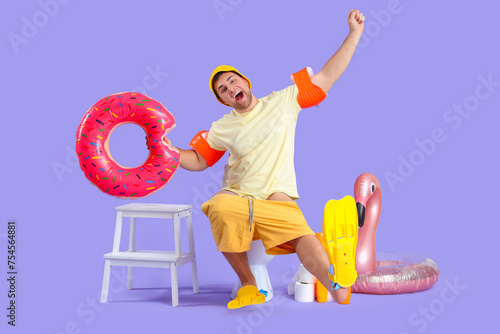 Male vacationer with beach ...