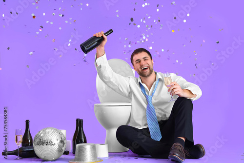 Drunk young businessman sit...