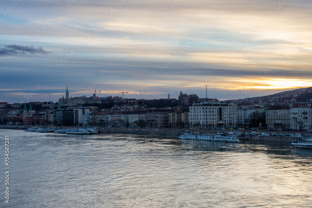 Beautiful sunset over Parliament Building and Danube River in Budapest, Hungary. Beautiful sunset over Parliament Building and Danube River in Budapest, Hungary.