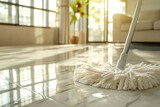 Sunlight Filters Through Windows onto Mop Cleaning Shiny Tile Floor