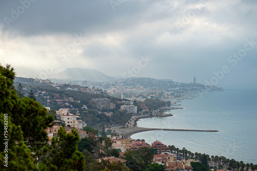 Panoramic aerial view of Malaga in a cloudy summer day in the morning in Malaga, Spain
