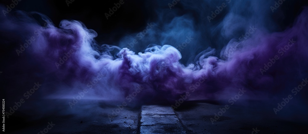 A swirling cloud of neon blue and purple smoke stands out against a dark, grungy background. The colors create an optical illusion, giving the impression of a futuristic spaceship stage. A swirling cloud of neon blue and purple smoke stands out against a dark, grungy background. The colors create an optical illusion, giving the impression of a futuristic spaceship stage.