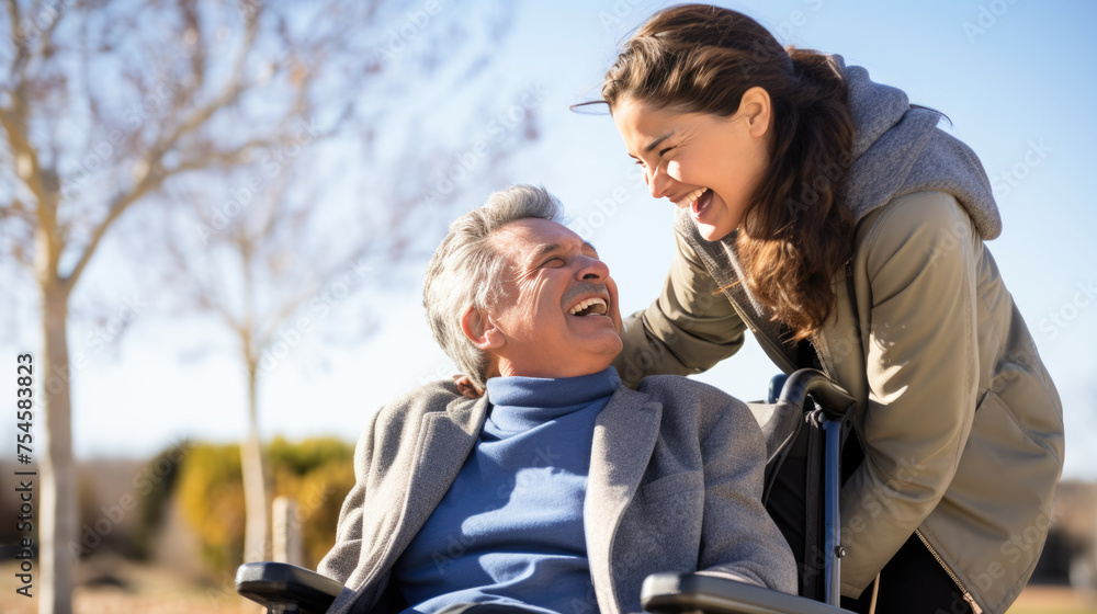Senior man in wheelchair with his daughter in autumn park Senior man in wheelchair with his daughter in autumn park