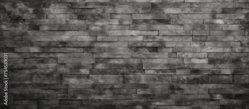 A black and white photo showcasing the abstract weathered gray grunge brick wall texture, perfect for dark interior room decoration and urban building material backdrop design.