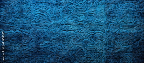 The close-up shot showcases a detailed view of a blue quilted material, perfect for interior design, wallpaper, background, or cover page purposes.