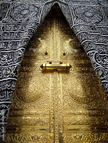 Replica the golden doors of the Holy Kaaba closeup, covered with Kiswah. Massive lock on the doors. Entrance to the Kaaba