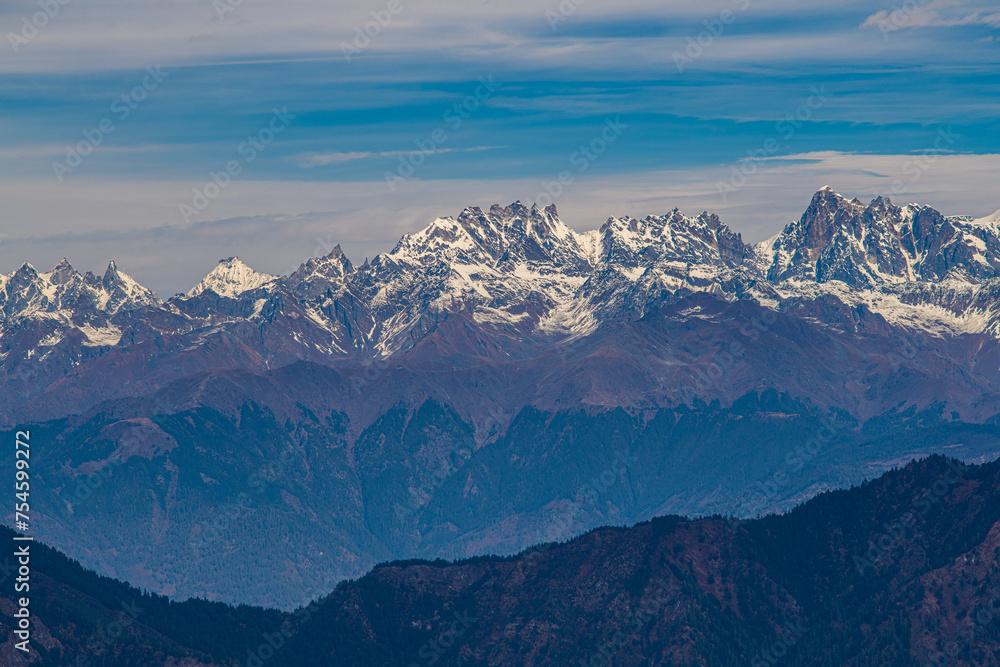 Jagged Peaks of the Himalayas Overlooking the Valleys from Murma Top, Nepal Jagged Peaks of the Himalayas Overlooking the Valleys from Murma Top, Nepal