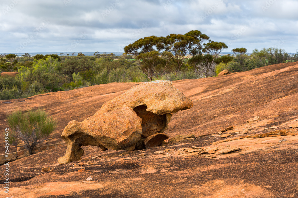 Beringbooding Rock is a granite rock formation north east of Mukinbudin in the eastern Wheatbelt region of Western Australia. The site features large balancing boulders with interesting shapes.