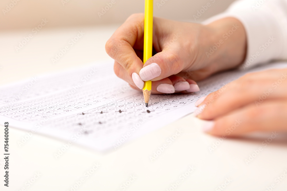 Hand filling in an Examination form. Hand filling in an Examination form.