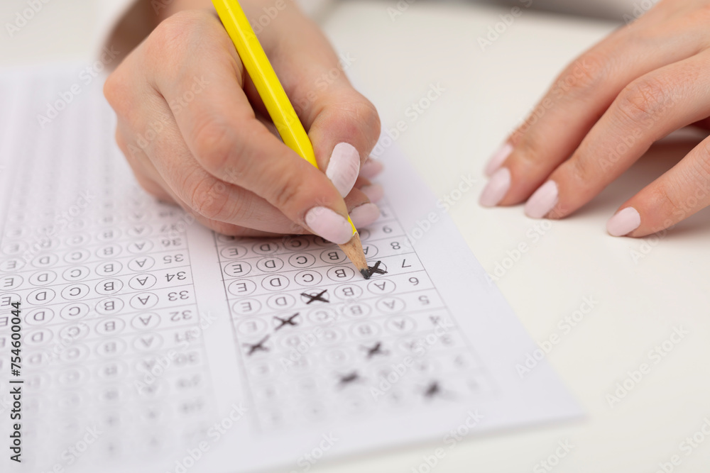 Hand filling in an Examination form. Hand filling in an Examination form.