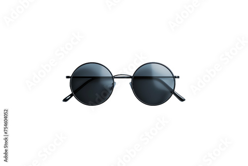 A stylish pair of sunglasses with black frames isolated on a background photo