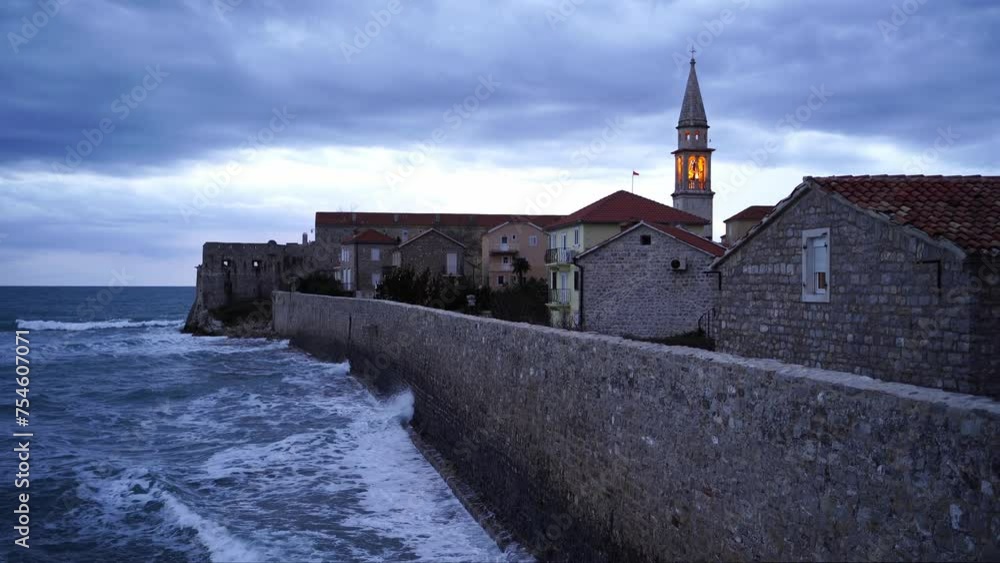 Sea waves roll on the fortress walls of the old town of Budva. Montenegro. High quality 4k footage