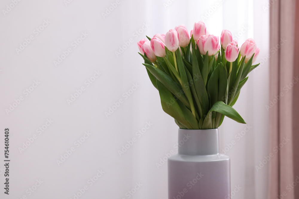 Beautiful bouquet of fresh pink tulips indoors. Space for text Beautiful bouquet of fresh pink tulips indoors. Space for text